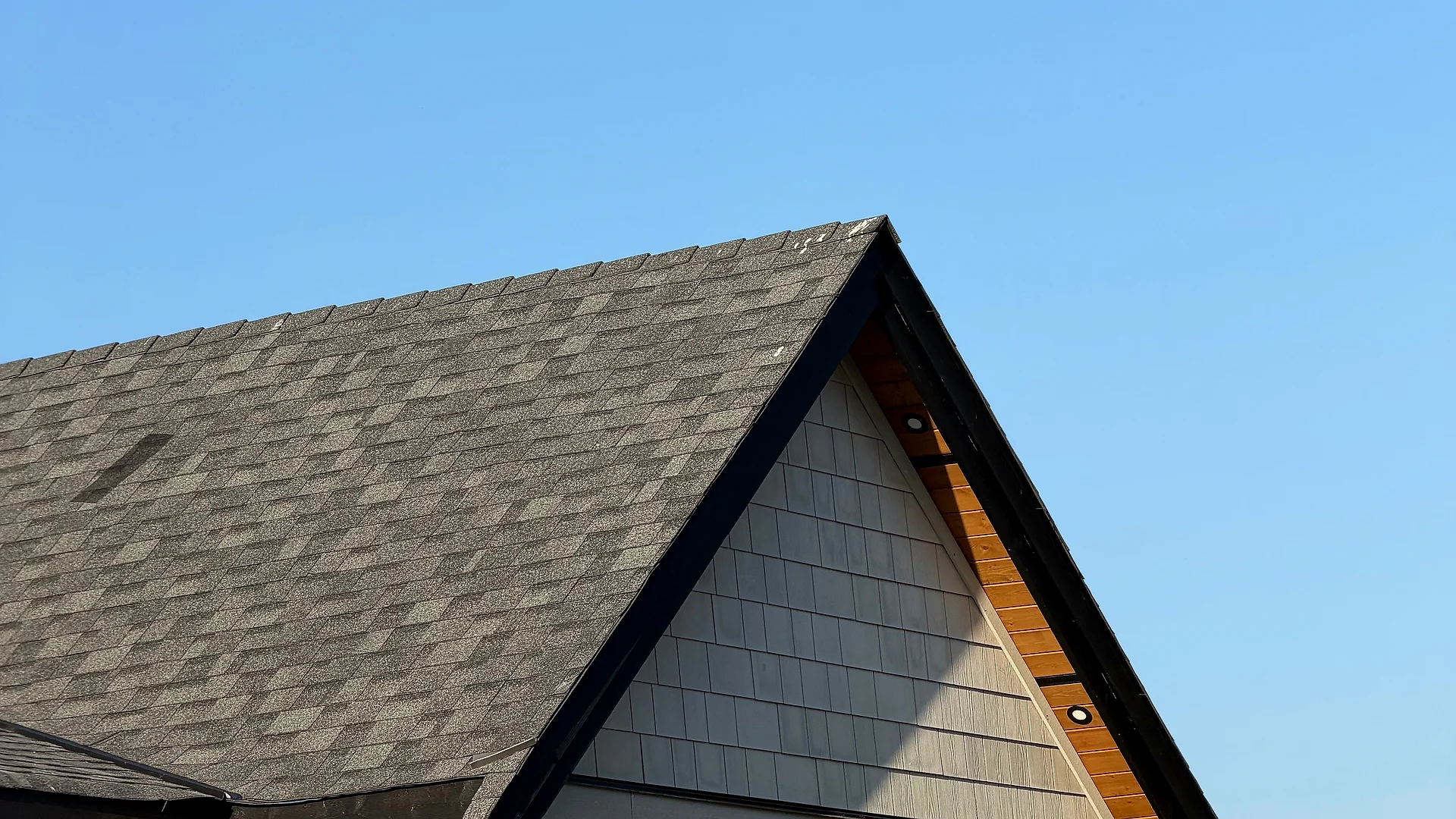 Garage gable with shake siding, board-and-batten and clear cedar soffit on a Langley, BC custom home