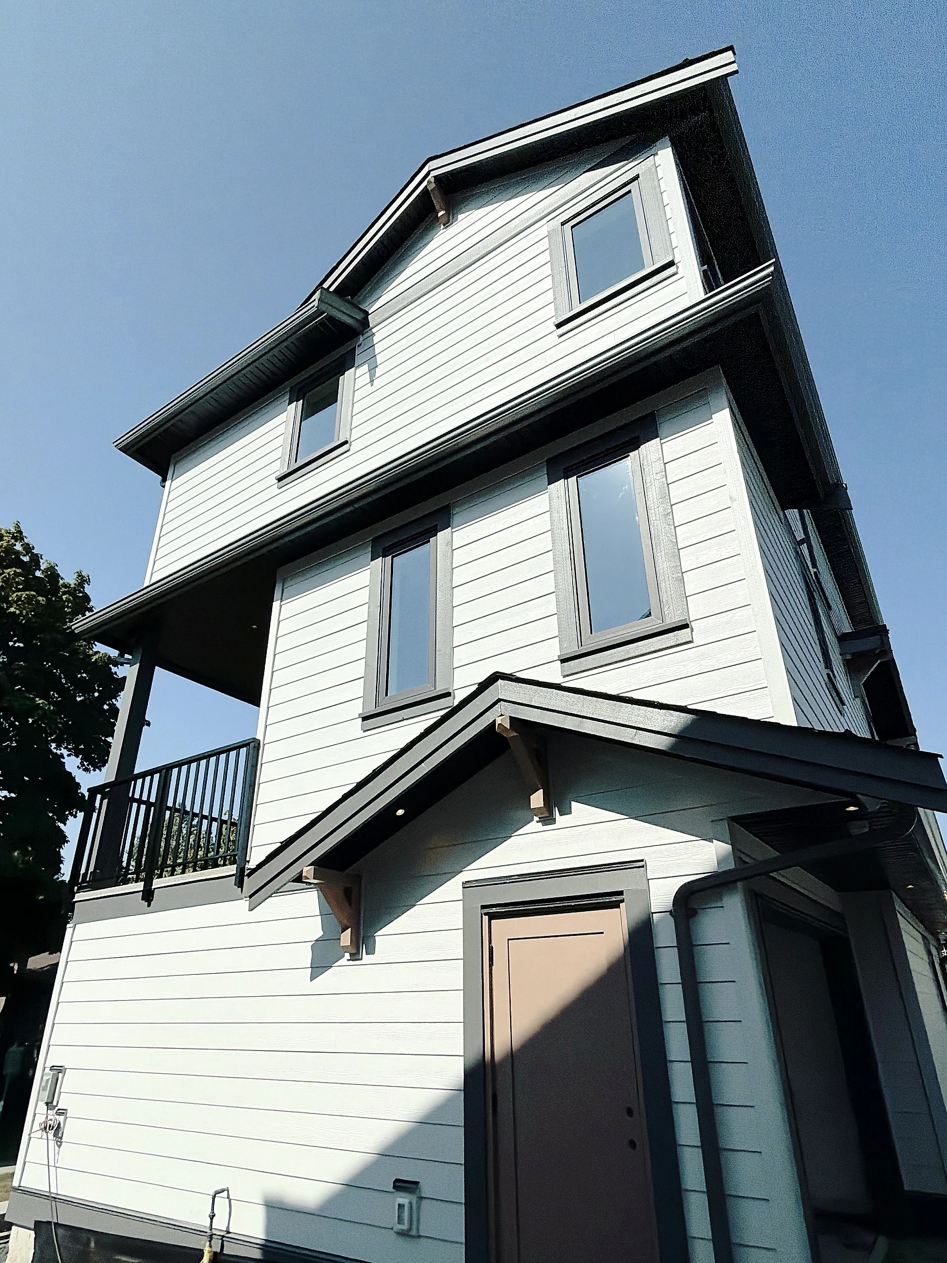 Rear elevation in white Hardie lap and shake, Burnaby BC