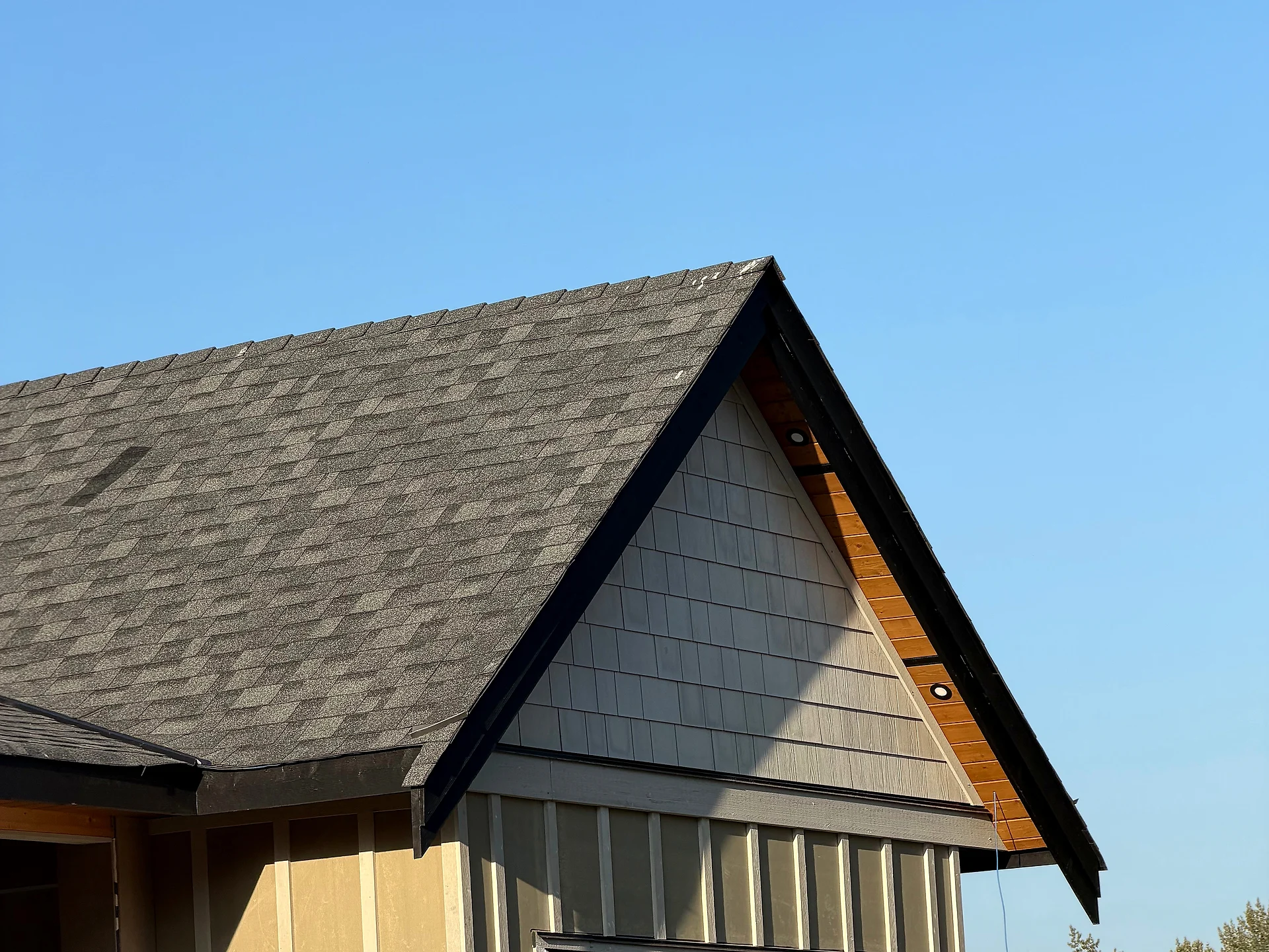 Garage gable with shake siding, board-and-batten and clear cedar soffit, Langley BC
