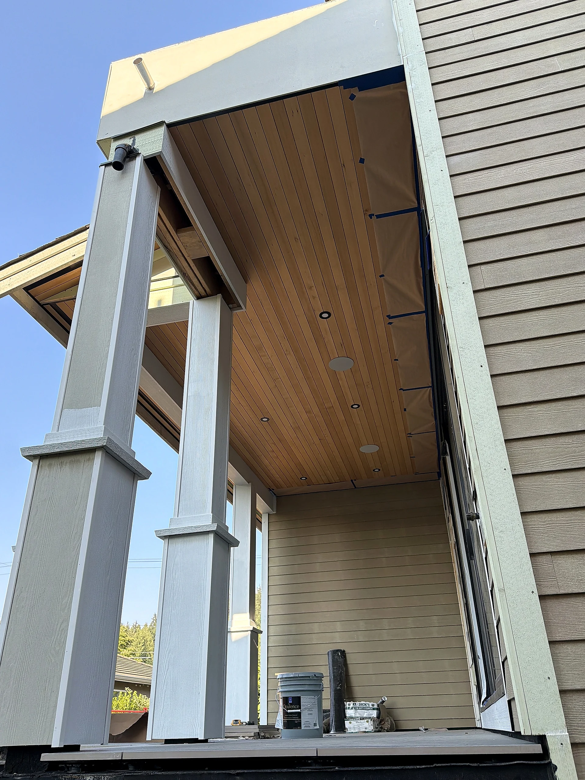 Wrapped column meeting the cedar porch ceiling, detail, North Vancouver BC