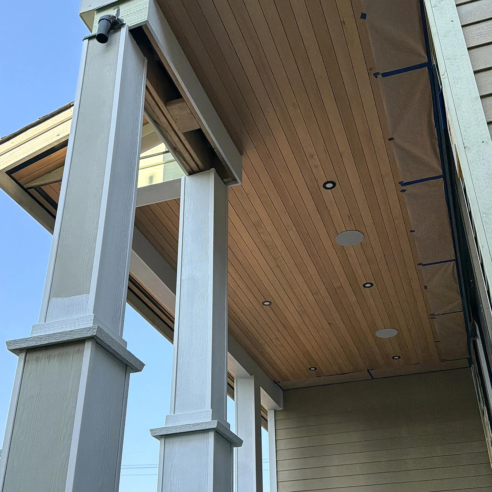 Underside of a cedar porch ceiling and columns, North Vancouver BC