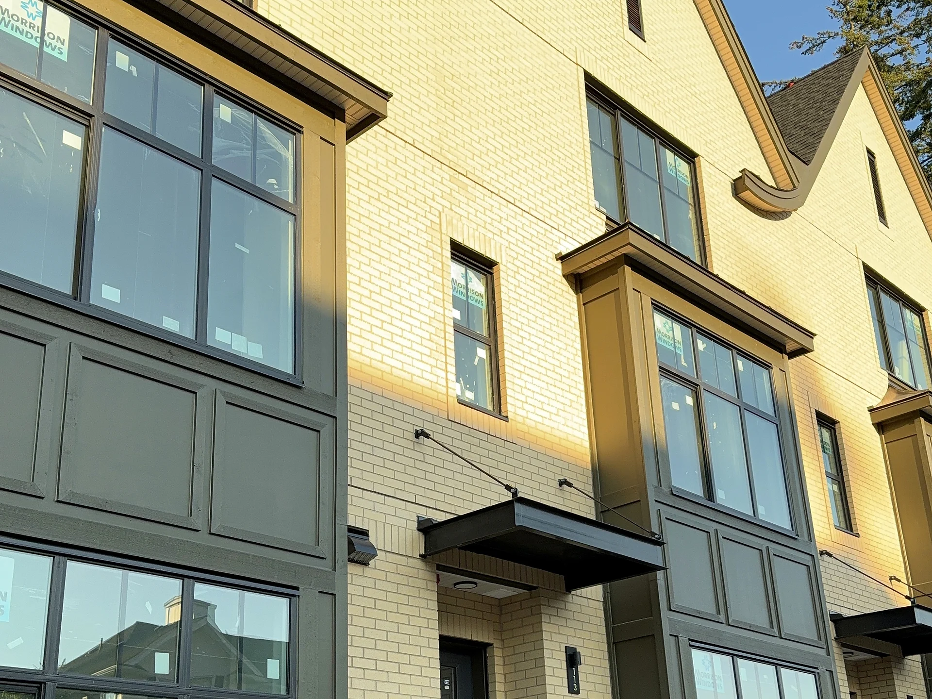 Row of townhouse entry canopies and panel bays, South Surrey BC