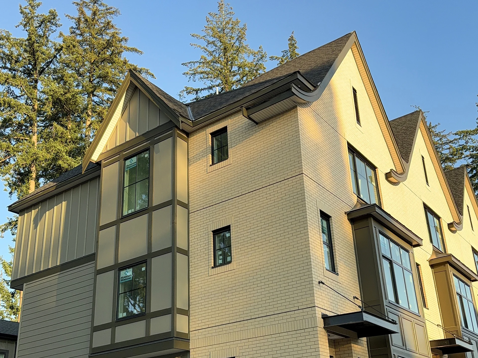 Row of shaped gables over panel bays, South Surrey BC