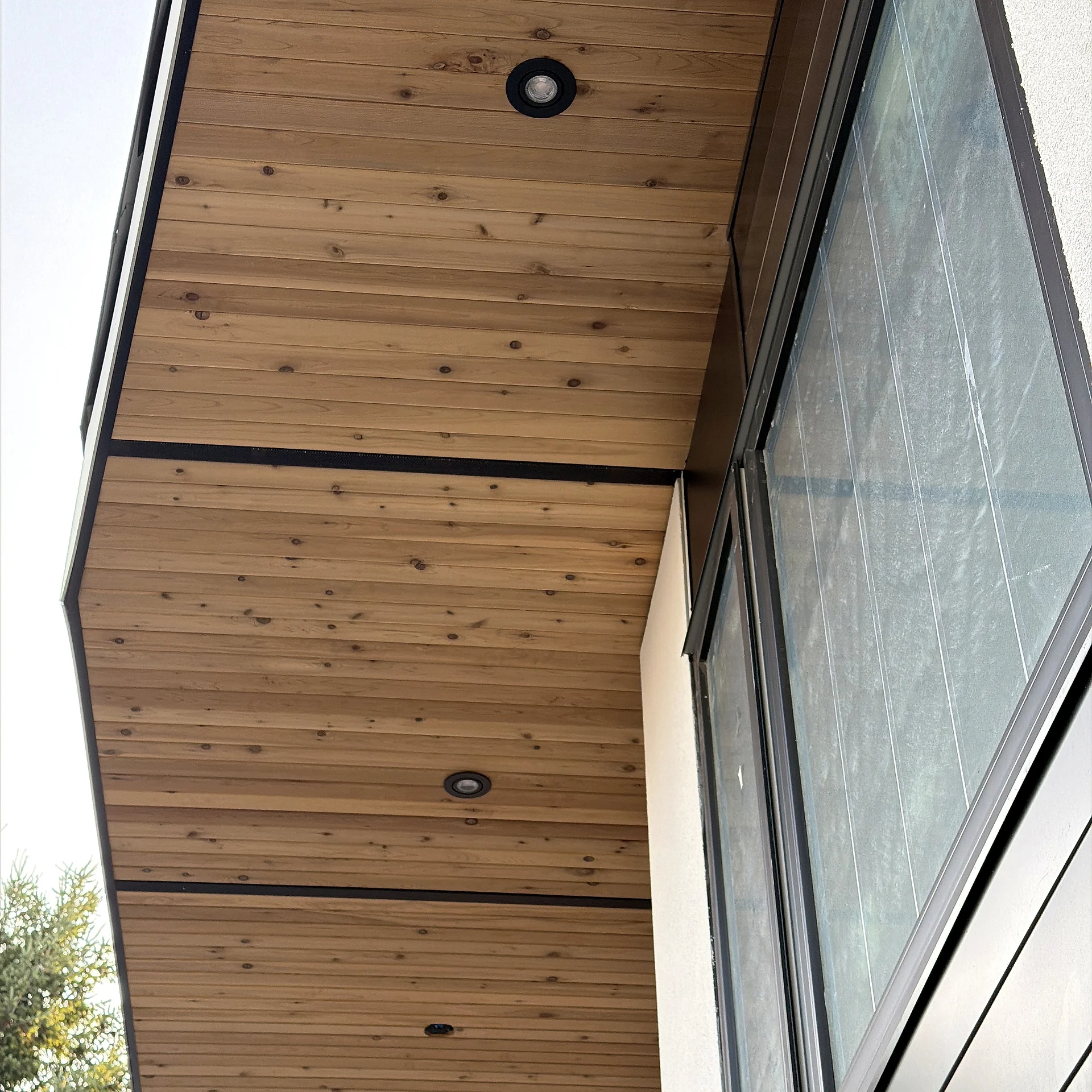 Clear cedar soffit over glazing on a modern home, Vancouver BC