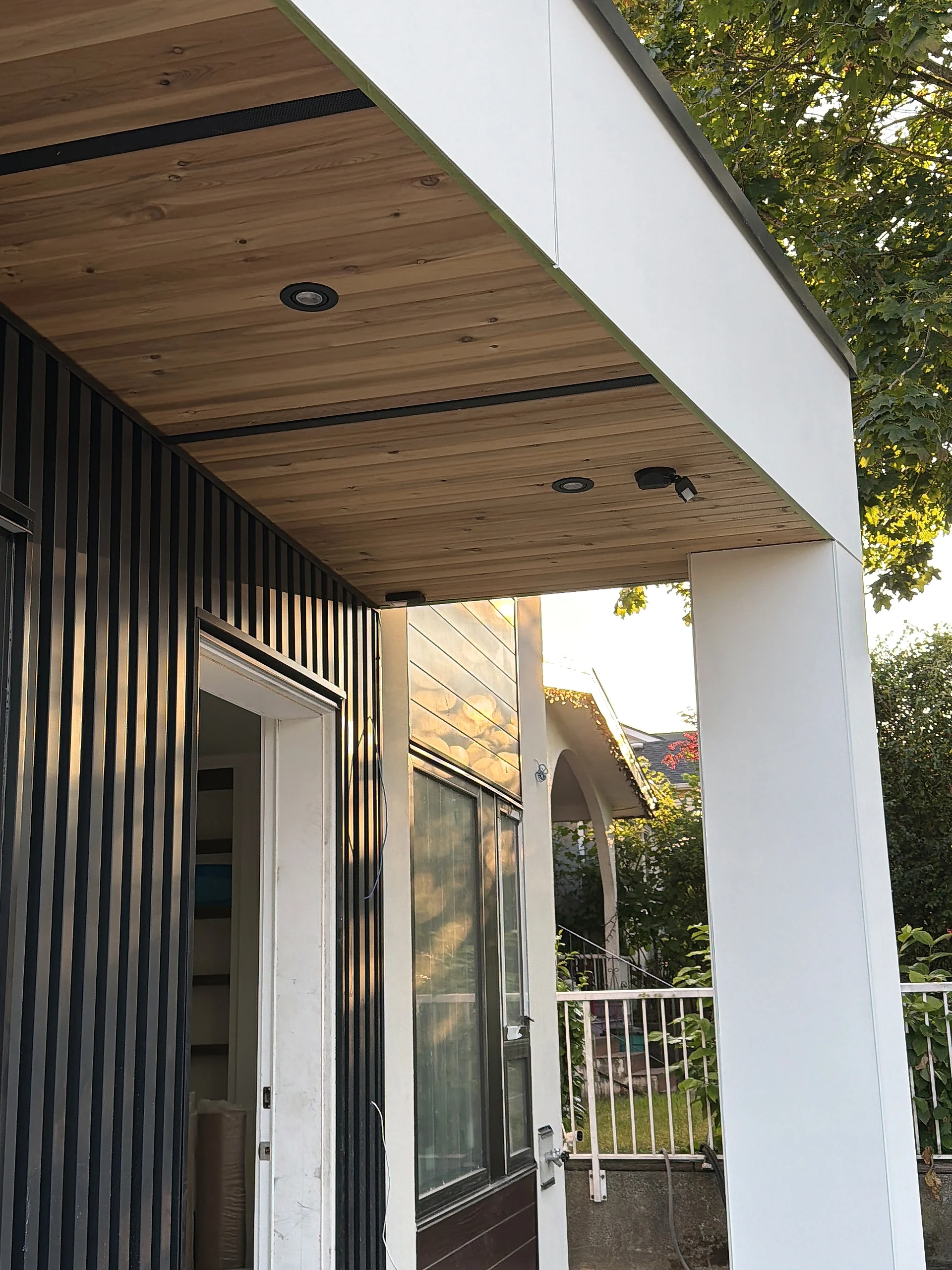 Porch with black slat screen and cedar soffit, Vancouver BC